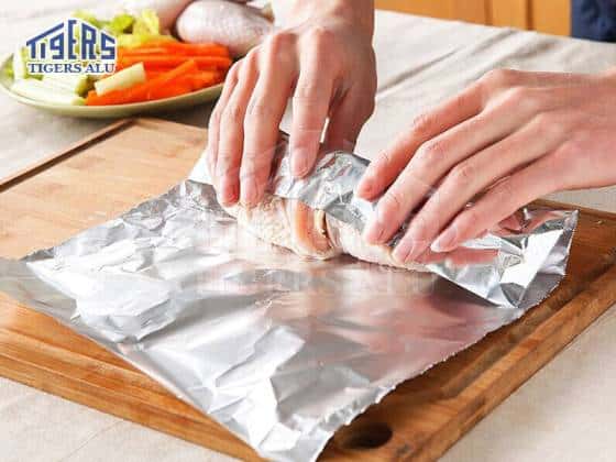 Wrap chicken thighs in aluminum foil